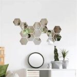 Hexagon Acrylic Mirror Wall Stickers – 12-Piece Set applied on a living room wall, reflecting light and enhancing room aesthetics.